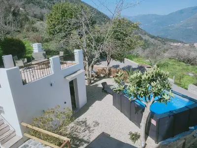 a villa with a swimming pool and a mountain at Maison Corse avec piscine et sauna - La Casa Lilia in Campile
