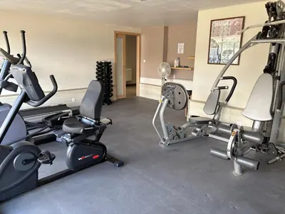 a gym with two treadmills and cardio machines at Résidence Cas’Antica in Propriano