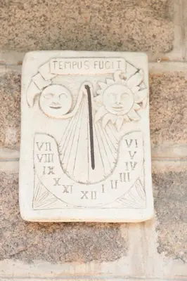 a sign on the side of a stone wall at Locations de La Casette d'Araggio in Porto-Vecchio
