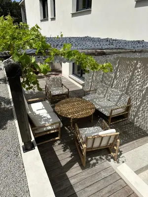 a group of chairs and a table on a patio at Appartement T2 Casa Di Simone Pietrosella Corse du Sud in Pietrosella
