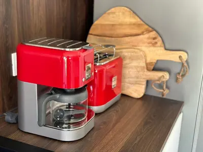 a red coffee maker sitting on top of a counter at Appartement T2 Casa Di Simone Pietrosella Corse du Sud in Pietrosella