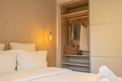 a living room with a couch and a flat screen tv at CADIAMARE in Zonza