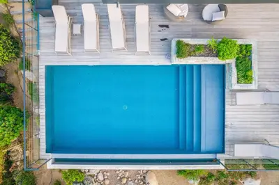 an overhead view of a blue swimming pool at Villa A Pinetta Villata in Sainte-Lucie de Porto-Vecchio