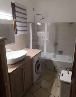 a bathroom with a sink and a toilet and a tub at Appartement vue mer Les hameaux de Propriano à Propriano in Propriano