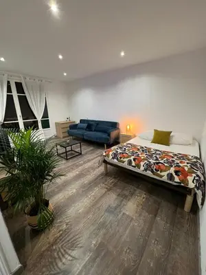 a bedroom with a bed and a couch in it at Appartement Centre Ville Dea in Ajaccio