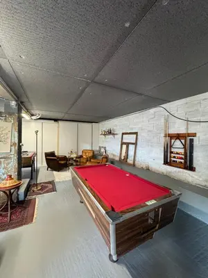 a large room with a pool table in it at Maison 47m2 à 10min des plages - billard, baby, salle de sport, jardin in Ajaccio
