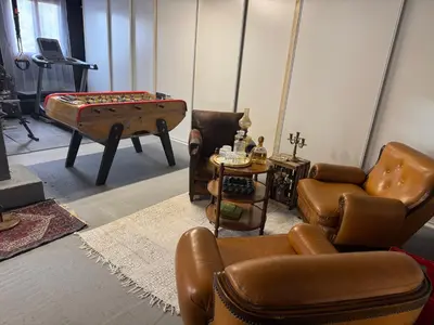 a living room filled with furniture and a pool table at Maison 47m2 à 10min des plages - billard, baby, salle de sport, jardin in Ajaccio