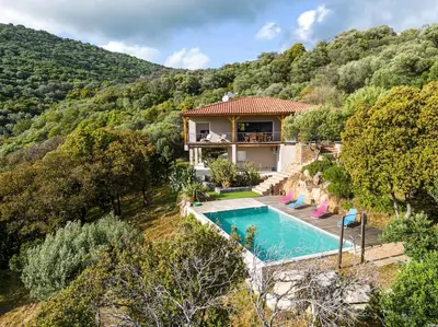 an image of a house with a swimming pool at Maison vue Mer et Maquis in Olmeto