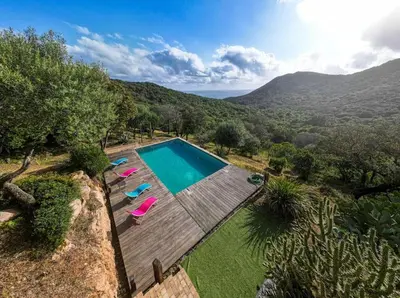 an overhead view of a swimming pool with lounge chairs at Maison vue Mer et Maquis in Olmeto