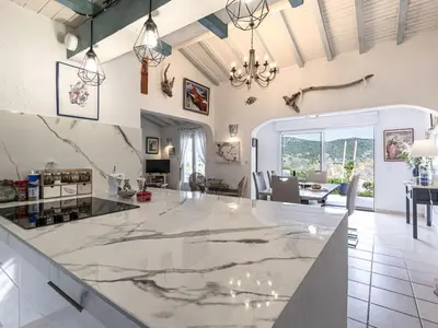 a kitchen with a large marble counter top at Holiday Home Paulka by Interhome in Sainte-Lucie de Porto-Vecchio