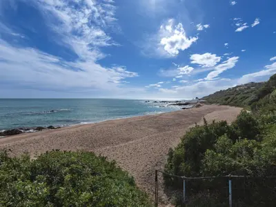 a view of a beach with the ocean at Holiday Home Paulka by Interhome in Sainte-Lucie de Porto-Vecchio