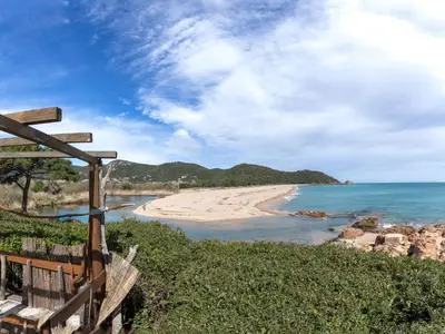 a view of a beach with a wooden fence at Holiday Home Samba by Interhome in Sainte-Lucie de Porto-Vecchio
