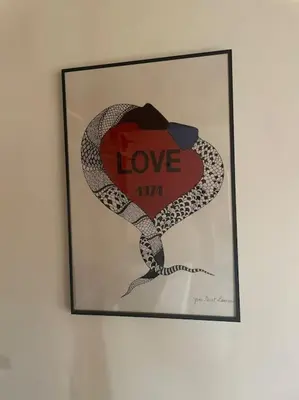a framed picture of a heart and a snake at Chalet in Tasso