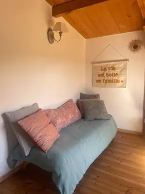 a bed with pillows on it in a room at Chalet in Tasso