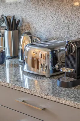 a toaster sitting on top of a kitchen counter at Résidence Casaviva in Calvi