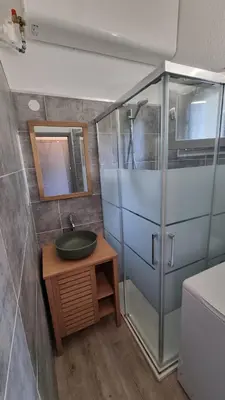 a bathroom with a sink and a shower at Azura Prugna - Maison avec piscine partagée in Grosseto-Prugna
