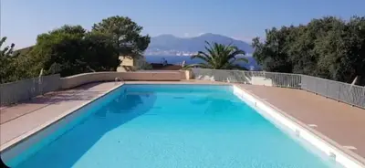 a large blue swimming pool in a house at Azura Prugna - Maison avec piscine partagée in Grosseto-Prugna