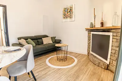 a living room with a couch and a tv at Casamea - Suite U Sognu in Talasani