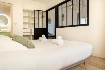 a bedroom with a large white bed with two pillows at Casamea - Suite U Sognu in Talasani