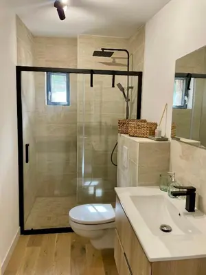 a bathroom with a shower and a toilet and a sink at Caseddu 100m de la plage in Belvédère