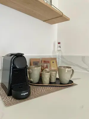 a tray with four coffee cups and a toaster at Caseddu 100m de la plage in Belvédère