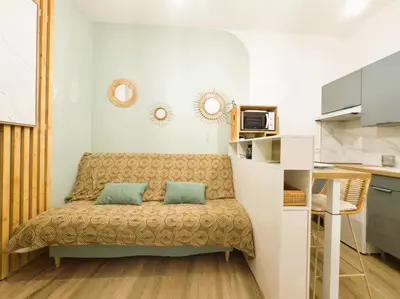 a living room with a couch in a room at Le cocon du Roi Jérôme - Hypercentre in Ajaccio