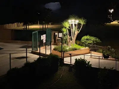 a street light in a park at night at Appartement n 302 moriani plage in Moriani Plage