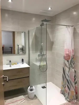 a bathroom with a shower and a toilet and a sink at Appartement à Ghisonaccia-Prunelli in Prunelli-di-Fiumorbo