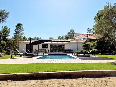 a villa with a swimming pool and a house at Villa ALVALMAX in Porto-Vecchio