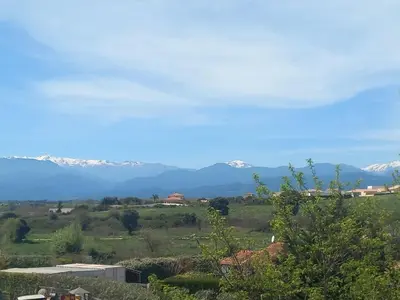a view of snow covered mountains in the distance at Appartement ALERIA 2/4 personnes in Aléria