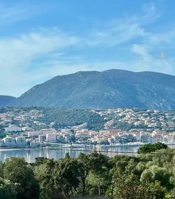 a view of a city and a mountain at Appartement à 2 pas de la plage in Olmeto
