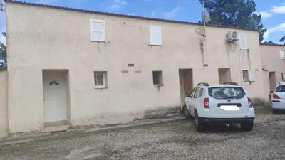 a car parked in a parking lot in front of a building at Villa les pieds dans l'eau in Borgo