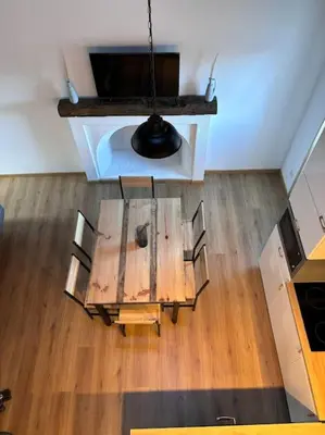 an overhead view of a table and chairs in a room at chez lulu Appartement cosy. in Cozzano