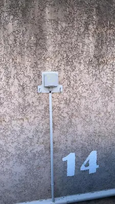 a camera on the street next to a wall at Maison en bord de mer, Plage de la Marana en Corse in Borgo