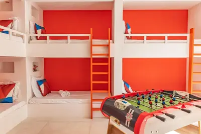 a kids room with bunk beds and a chess board at Casa Campa di Pinarello in Sainte-Lucie de Porto-Vecchio