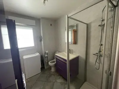 a bathroom with a shower and a sink and a toilet at Immeuble le Mozart in Ajaccio