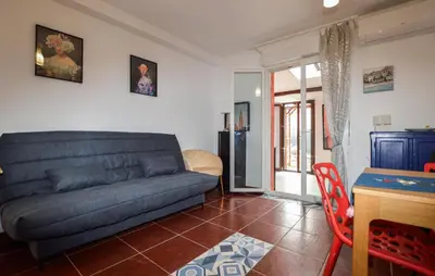 a living room with a couch and a table at Awesome Home In Prunete With Wifi in Prunete
