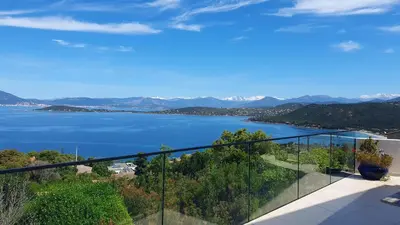 a view of a lake from a balcony at loft de standing 150 m2 vue mer,de 2 à 6 pers à Mare e Sole Plage d'argent Verghia in Coti-Chiavari