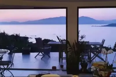 a view of a room with a view of the water at loft de standing 150 m2 vue mer,de 2 à 6 pers à Mare e Sole Plage d'argent Verghia in Coti-Chiavari