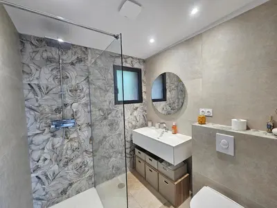 a bathroom with a shower and a sink and a mirror at U Paradisu in Piana
