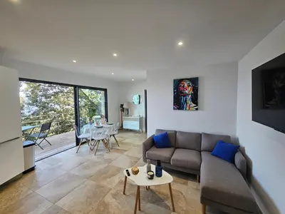 a living room with a couch and a table at U Paradisu in Piana