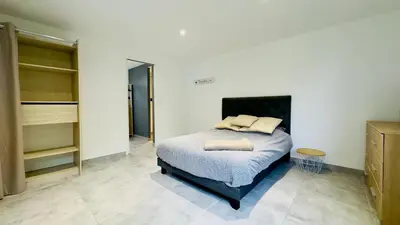 a bedroom with a bed in a room at CASA CUCCHI in Porto-Vecchio