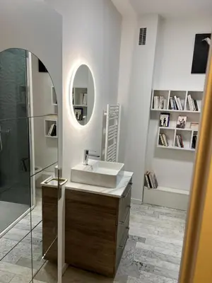 a bathroom with a sink and a mirror at Grand Studio terrasse vue sur mer et parking in Ajaccio