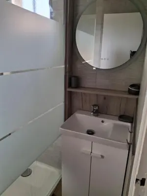 a bathroom with a sink and a mirror at TERRA BELLA 2 in Grosseto-Prugna