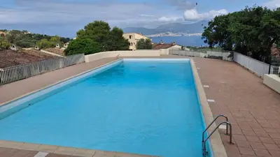 a large blue swimming pool on top of a house at TERRA BELLA 2 in Grosseto-Prugna