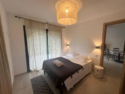 a bedroom with a bed and a large window at CASA ALTEZZA in Soveria
