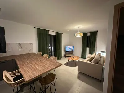 a living room with a table and a couch at CASA ALTEZZA in Soveria