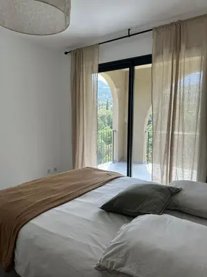 a bedroom with a large bed with a large window at CASA ALTEZZA in Soveria