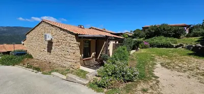 a small stone house on the side of a road at Mini Caseddu T2, Piscine & vue mer, Alba Rossa N11 in Serra-di-Ferro