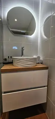 a bathroom with a sink and a mirror at Mini Caseddu T2, Piscine & vue mer, Alba Rossa N11 in Serra-di-Ferro